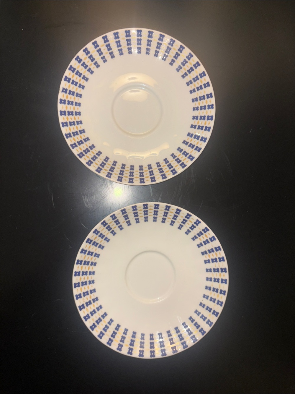 Set of 2 fine bone porcelain White Saucer with Blue and yellow Geometric Border